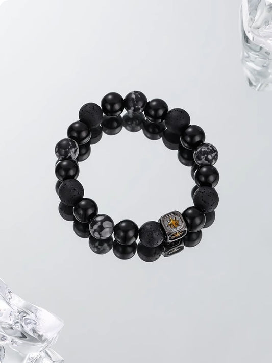 bracelet pierre de lave “étoile” sur surface réfléchissante